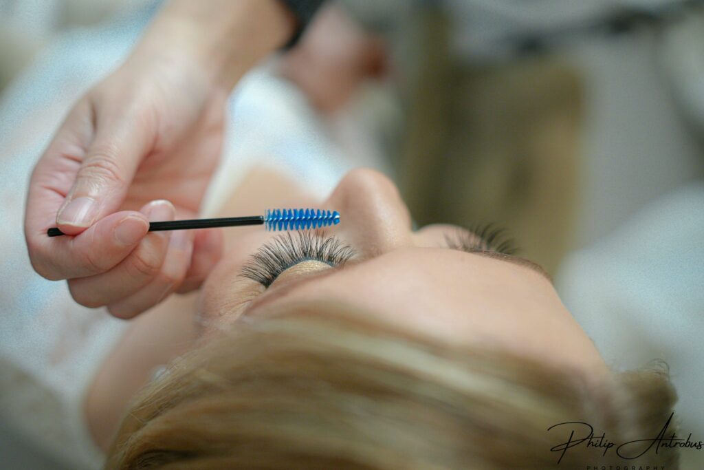 Applying mascara during bridal Prep at Chester wedding venue
