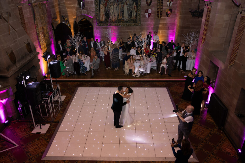 Couple's first dance at castle wedding reception.