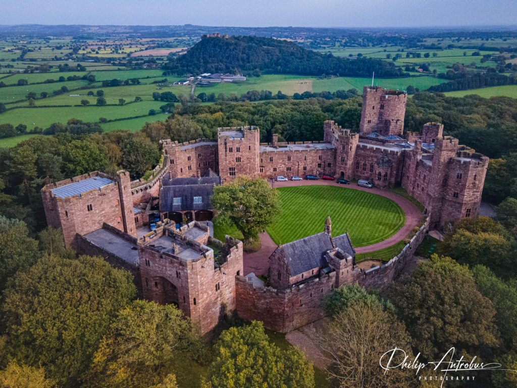Drone photograph of Peckforton Castle in the countryside.