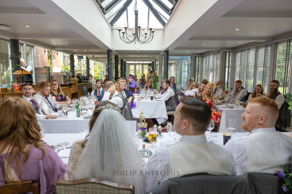 Wedding guests dining in the Oakfield restaurant at wedding at Chester Zoo.