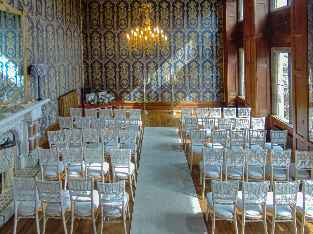 Elegant vintage room with chairs for event.