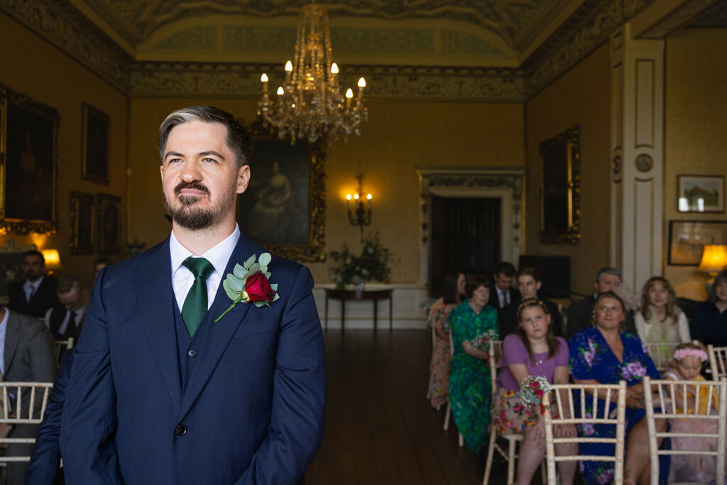 Groom waiting at wedding ceremony venue.