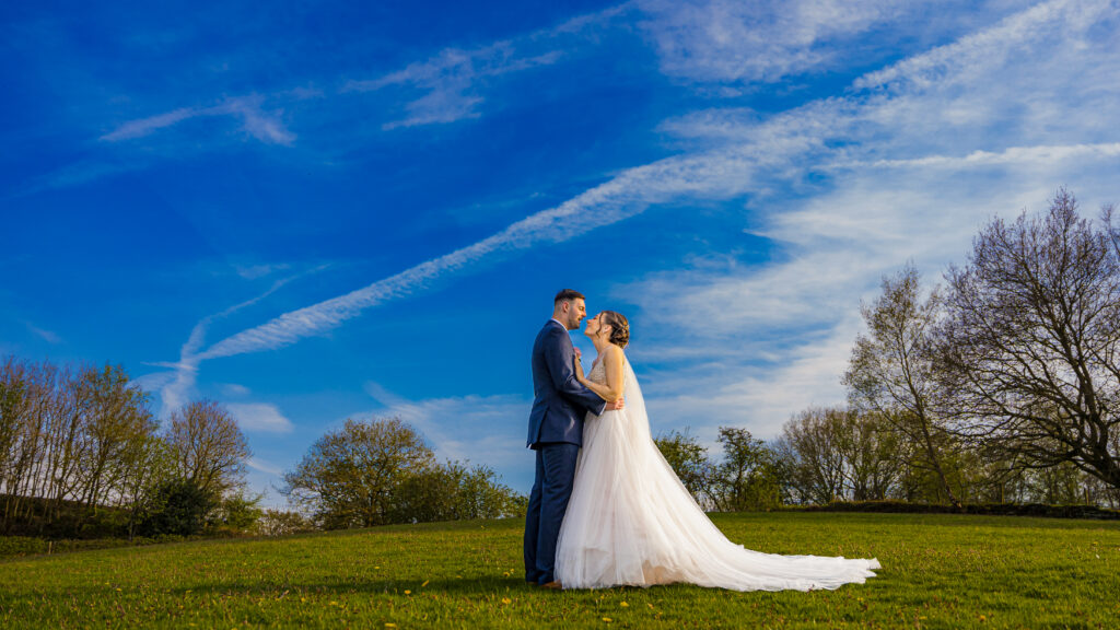 Bride and groom in scenic outdoor setting at Forest Hills Wedding Venue Frodsham
