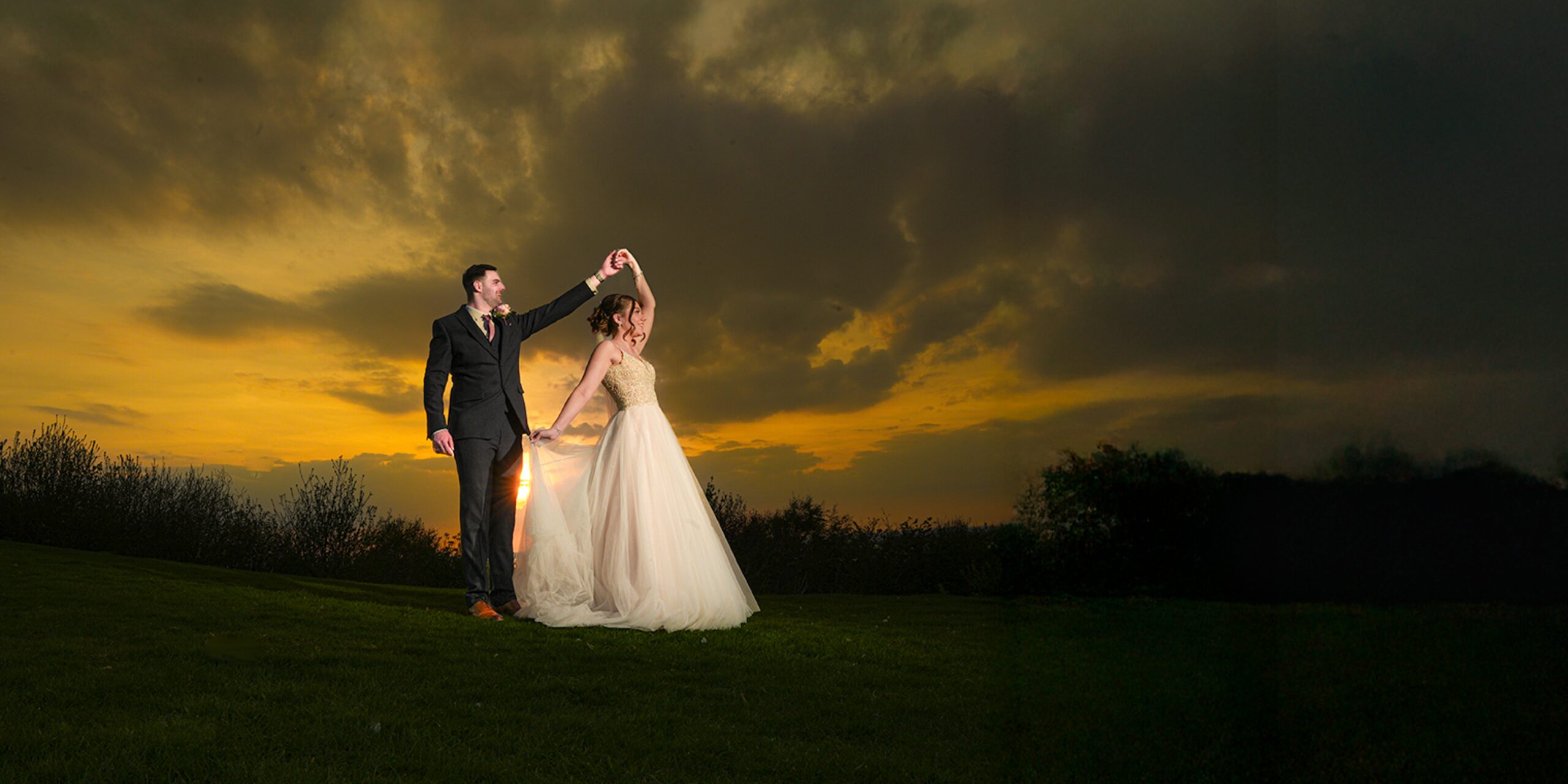 Couple dancing at sunset on wedding day at Forest Hills Frodsham. 