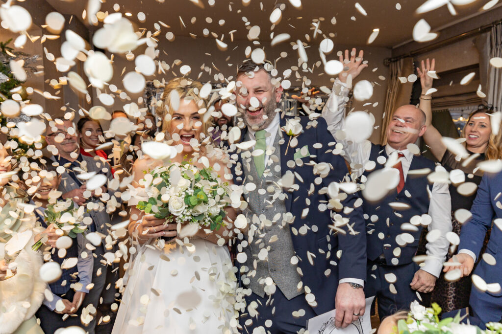 Joyful wedding confetti celebration scene with Philip Antrobus Photography