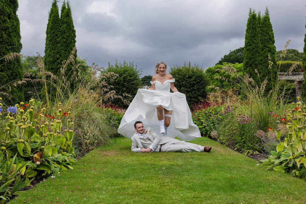 Bride jumps over groom in Abbeywood Estate Wedding 