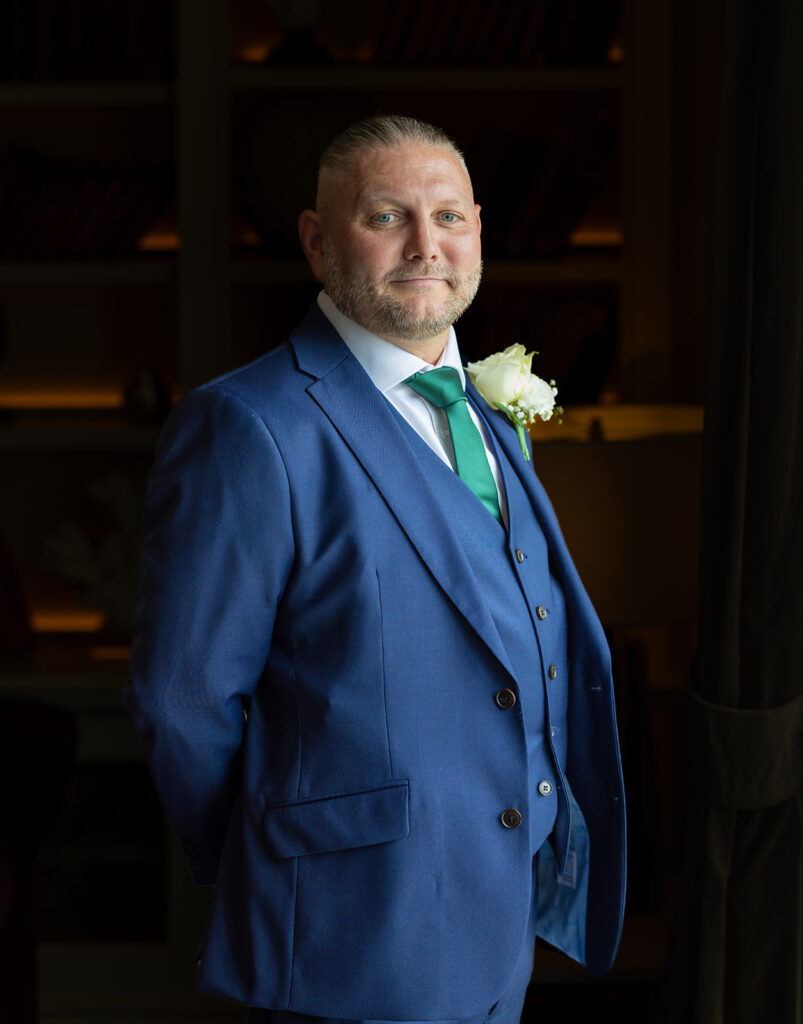 Groom having his picture taken at Carden Park Chester