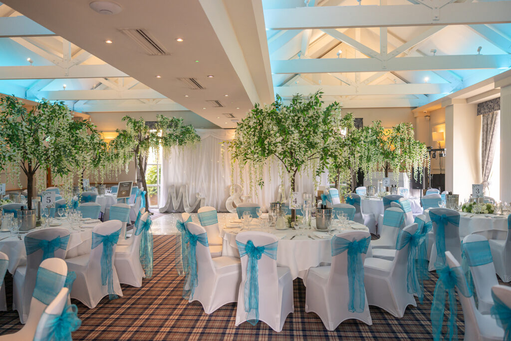 The Shooting Lodge at Carden Park set up for a wedding reception.